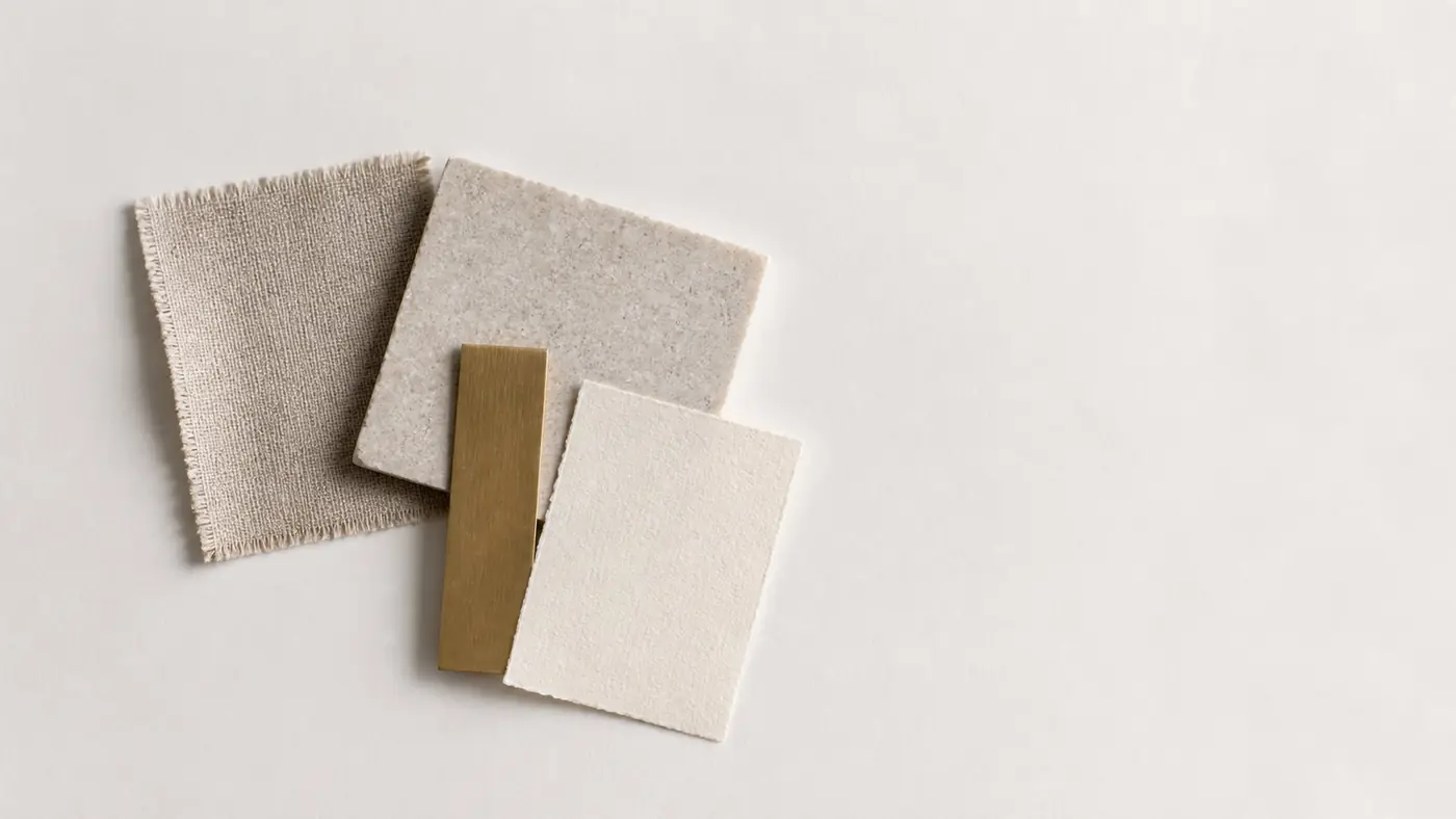 Printed brand sheets fanned across a linen surface