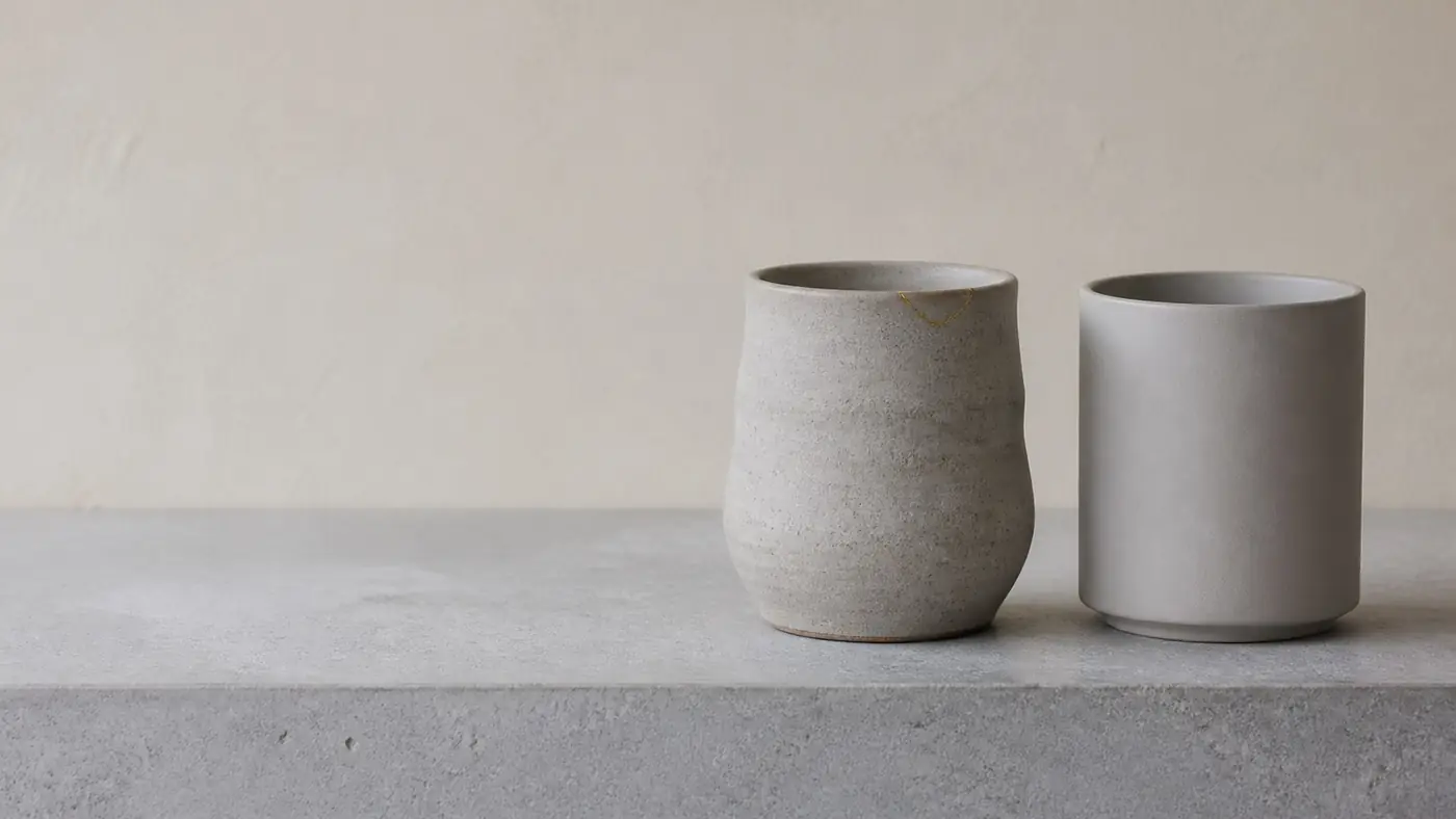 Packed orders lined up on a workbench under a hanging lamp
